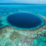 Whether your diving or witnessing our Great  Blue Hole from above, it will never disappoint. Located near the center of the Lighthouse Reef Atoll, the Blue Hole Natural Monument can be experienced by a day dive-boat trip, live-aboard dive vessel, or by air tour.  Is this on your bucket list?  #TravelBelize