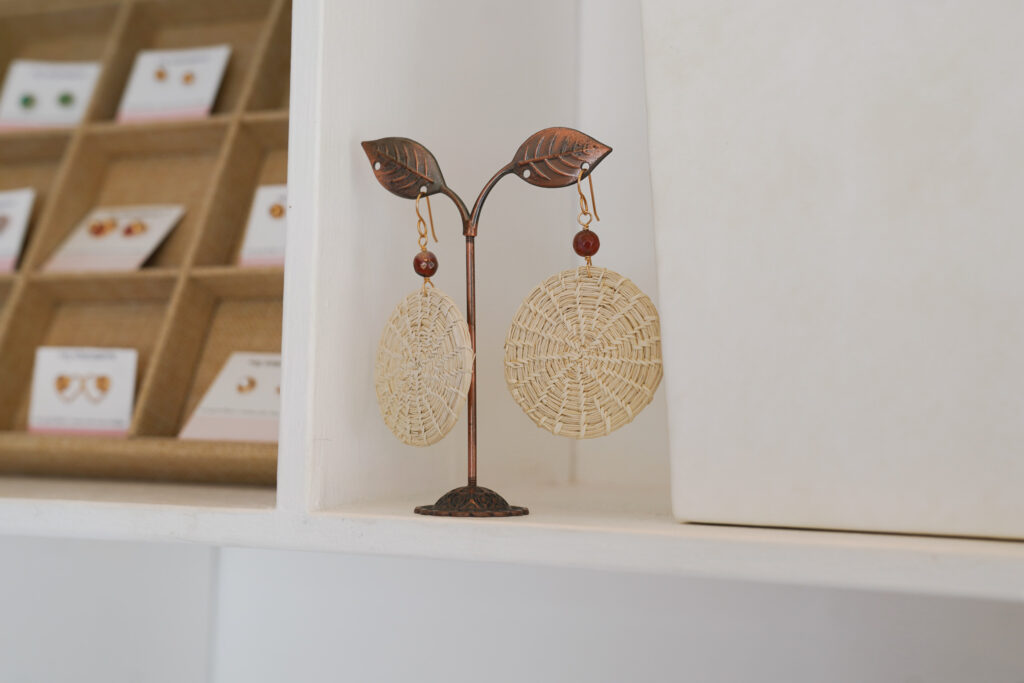 Handwoven artisan earrings displayed in a boutique, a thoughtful keepsake from anniversary trip ideas in Central America.
