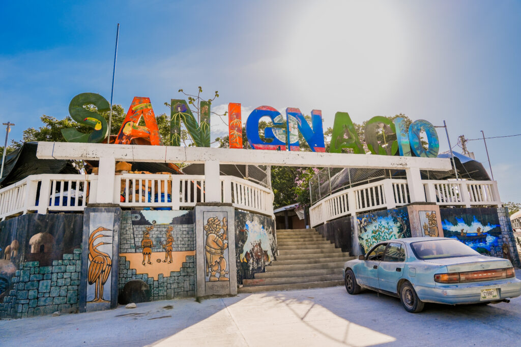 Colorful San Ignacio sign in Belize, a vibrant stop for couples exploring the best nature experiences in Belize for couples.