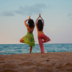 women doing yoga on the beach in Belize