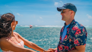 Couple holding hands on a yacht in Belize