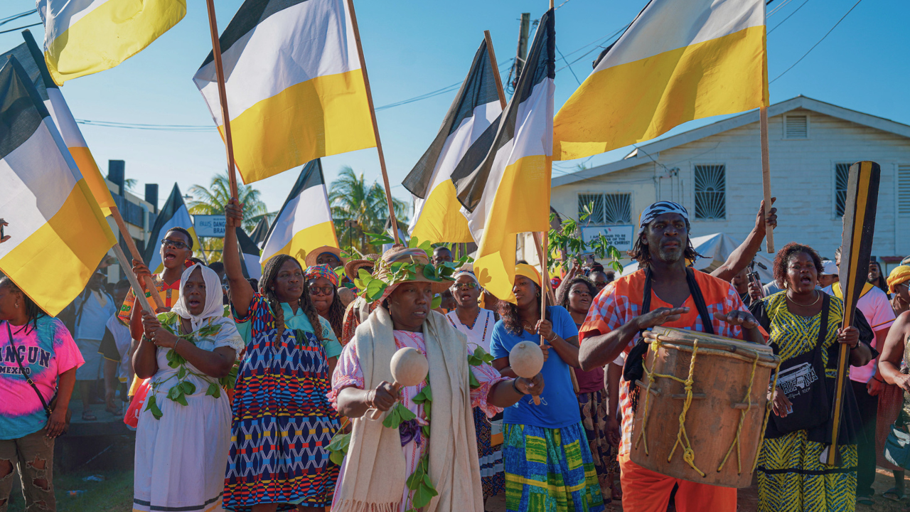 Procession of Garifuna people in Belize for Garifuna Settlement Day